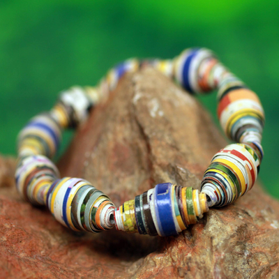 Recycled paper stretch bracelet, 'Storyteller' - Multicolor Handmade Bracelet with Recycled Paper Beads