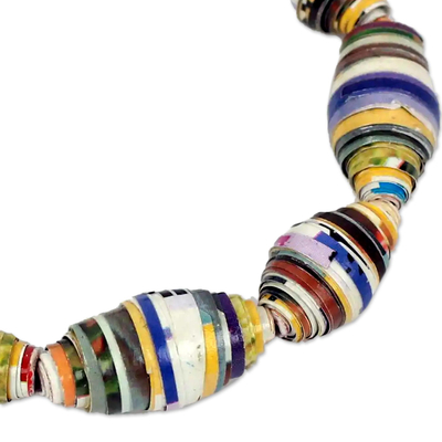 Recycled paper stretch bracelet, 'Storyteller' - Multicolor Handmade Bracelet with Recycled Paper Beads