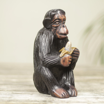 Ebony wood figurine, 'Monkey Peeling a Banana' - Hand Carved Animal Theme Figurine African Ebony Sculpture