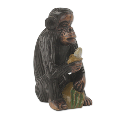 Ebony wood figurine, 'Banana Snack' - Hand Carved Monkey Theme African Ebony Sculpture