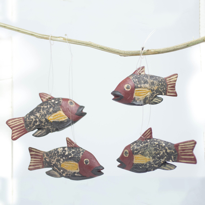 Wood ornaments, 'Little Ghanaian Fish' (set of 4) - Ghana Artisan Crafted Fish Theme Ornaments (Set of 4)