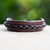 Men's leather bracelet, 'Simple Twist in Brown' - Handmade Men's Leather Bracelet with Braided Accent thumbail