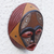 Afrikanische Holzmaske - Handgefertigte kreisförmige westafrikanische Wandmaske in Rottönen