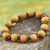 Wood stretch bracelet, 'Labadi Warmth' - Handcrafted Stretch Bracelet with Wood Beads thumbail