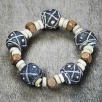 Terracotta beaded stretch bracelet, 'Dreams at Dusk' - Terracotta and Sese Wood Beaded Stretch Bracelet from Ghana