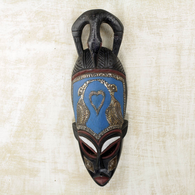 Afrikanische Holzmaske, 'Wogali'. - Afrikanische Holzmaske mit Papageienmotiv aus Messing und Aluminium