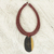 Ebony wood pendant necklace, 'Zacksongo in Wine' - Ebony Wood Pendant Necklace with Wine Leather Cord (image 2) thumbail