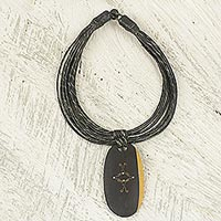 Ebony wood pendant necklace, 'Zacksongo in Black' - Ebony Wood Pendant Necklace with Black Leather Cord
