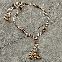 Wood and ceramic beaded pendant necklace, 'Rustic Destiny' - Wood and Clay Beaded Pendant Necklace from Ghana