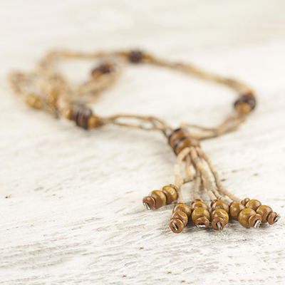 Wood and ceramic beaded pendant necklace, 'Rustic Destiny' - Wood and Clay Beaded Pendant Necklace from Ghana