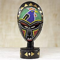 African wood mask, 'Mirembe' - Hand Carved Sese Wood Mask with Glass Bead and Brass Accents