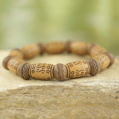 Beaded stretch bracelet, 'Dream Token' - Star Motif Recycled Bead Stretch Bracelet Ghana Jewelry
