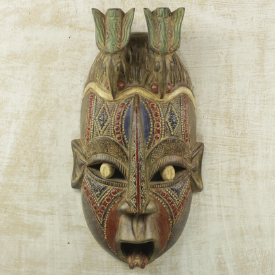 Afrikanische Holzmaske - Mehrfarbige handgeschnitzte Wandmaske aus afrikanischem Holz mit Tauben