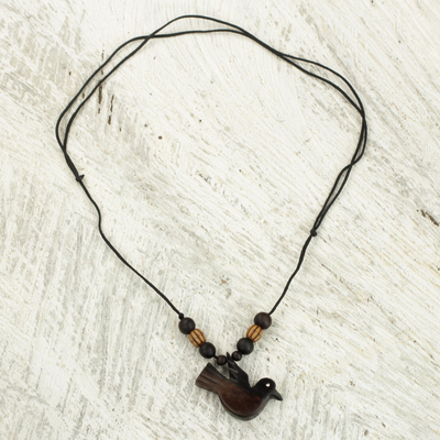 Wood pendant necklace, 'Victory Bird' - Peace Bird Artisan Crafted Wood Pendant Necklace from Ghana