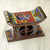 Perlen dekorativer Holzhocker, „Adinkra Sankofa“ – Dekorativer perlenbesetzter afrikanischer Holz-Schema mit Adinkra-Symbolen