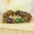 Recycled glass beaded bracelet, 'Divine Mawuena' - Green and Brown Recycled Glass Beaded Bracelet rom Ghana