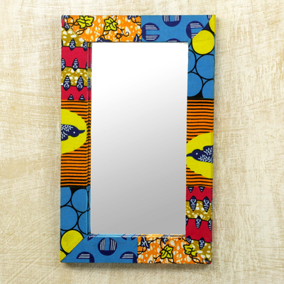 Espejo de pared de madera y algodón, 'Asasaawa' - Espejo de pared con marco de tela con estampado brillante de Ghana