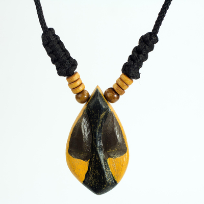 Wood pendant necklace, 'Manubea' - African Style Hand Carved Wood Necklace with Female Mask