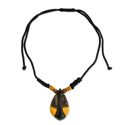 Wood pendant necklace, 'Manubea' - African Style Hand Carved Wood Necklace with Female Mask