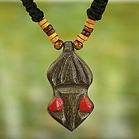 Wood pendant necklace, 'Gyau Atiko' - Hand Carved Wooden Pendant and Cord Necklace from Ghana