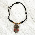 Wood pendant necklace, 'Gyau Atiko' - Hand Carved Wooden Pendant and Cord Necklace from Ghana
