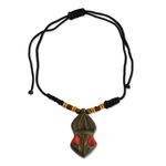 Wood pendant necklace, 'Gyau Atiko' - Hand Carved Wooden Pendant and Cord Necklace from Ghana