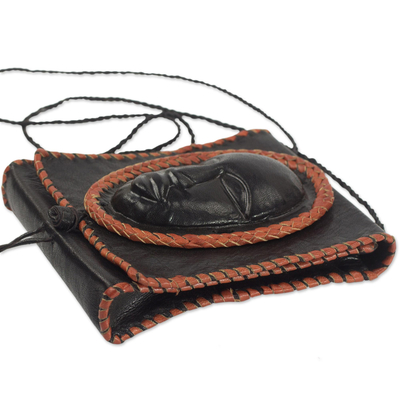 Leather cell phone shoulder bag, 'Watcher' - Black Leather Cell Phone Shoulder Bag with a Face from Ghana