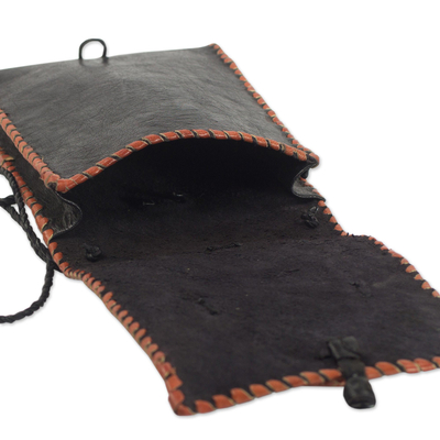 Leather cell phone shoulder bag, 'Watcher' - Black Leather Cell Phone Shoulder Bag with a Face from Ghana