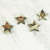 Wood ornaments, 'Nsruma Sophistication' (set of 4) - Four Sese Wood Star Ornaments in Black Red and White thumbail