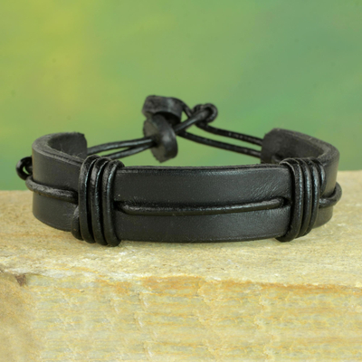 Men's leather wristband bracelet, 'Enduring Strength in Black' - Men's Black Leather Wristband Bracelet from Ghana