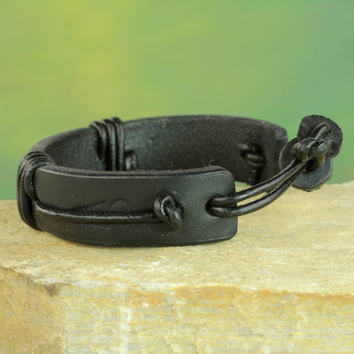 Men's leather wristband bracelet, 'Enduring Strength in Black' - Men's Black Leather Wristband Bracelet from Ghana
