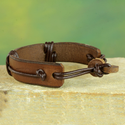 Men's leather wristband bracelet, 'Enduring Strength in Brown' - Men's Brown Leather Wristband Bracelet from Ghana