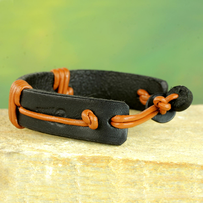 Men's leather wristband bracelet, 'Enduring Strength' - Men's Brown and Black Leather Wristband Bracelet from Ghana