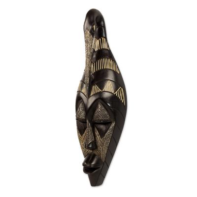African wood mask, 'Back to My Roots' - Hand Carved Black Sese Wood Wall Mask with Bird from Ghana
