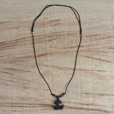 Wood pendant necklace, 'Akokonan' - Sese Wood Akokonan Adinkra Symbol Necklace from Ghana