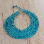 Leather statement necklace, 'Pogyende' - Handmade Emerald Leather Strand Statement Necklace of Ghana