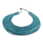Leather statement necklace, 'Pogyende' - Handmade Emerald Leather Strand Statement Necklace of Ghana