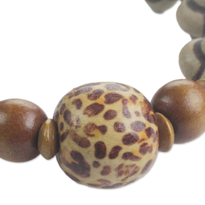 Wood beaded stretch bracelet, 'Pattern Play' - Hand Made Earth Tone West African Wood Bead Stretch Bracelet