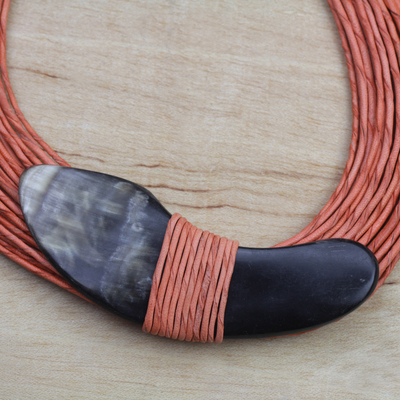 Horn pendant necklace, 'Tuumsongo' - Boomerang Horn Pendant Orange Leather Cord Necklace