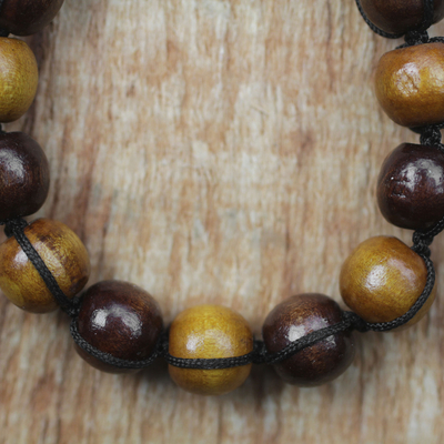 Wood beaded bracelet, 'Lively Shades' - Adjustable Sese Wood Beaded Bracelet from Ghana
