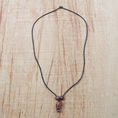 Wood and recycled plastic pendant necklace, 'Amazing Skull' - Wood and Recycled Plastic Skull Necklace from Ghana