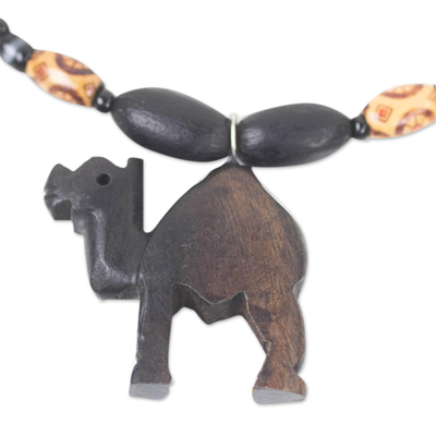 Ebony wood and recycled glass beaded pendant necklace, 'Gazing Camel' - Ebony Wood and Recycled Glass Camel Necklace from Ghana