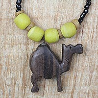 Ebony wood and recycled glass beaded pendant necklace, 'On Dry Land' - Ebony Wood and Glass Camel Pendant Necklace from Ghana