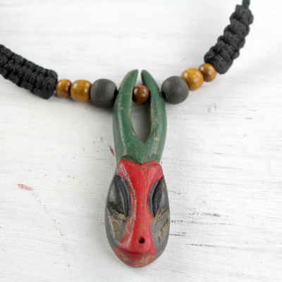 Wood pendant necklace, 'Onua Do Horn' - African Mask Hand Carved Sese Wood Necklace