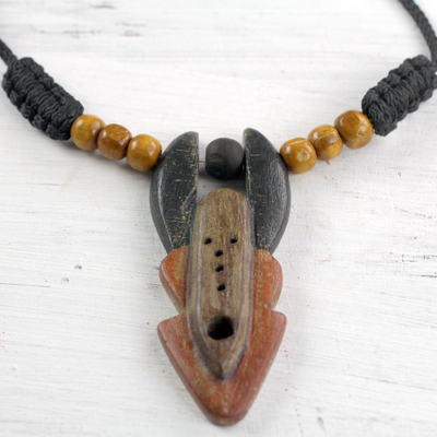 Wood pendant necklace, 'Elegant Horn Mask' - Hand Carved Sese Wood Red Black Horn Mask Necklace