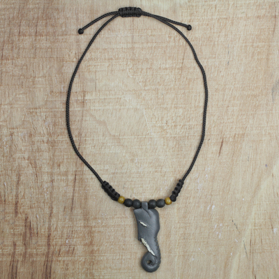 Wood pendant necklace, 'Osun Kukurudu' - Hand Carved Sese Wood Elephant Pendant Necklace