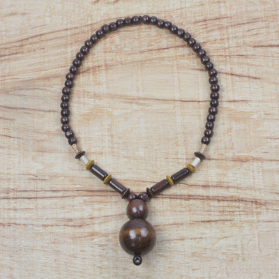 Wood and recycled plastic beaded pendant necklace, 'Nkwa Hia' - Wood and Recycled Plastic Beaded Pendant Necklace from Ghana