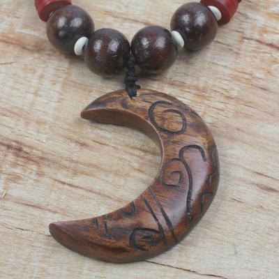 Wood and recycled plastic beaded pendant necklace, 'Kae Me Moon' - Wood and Recycled Plastic Beaded Pendant Necklace from Ghana