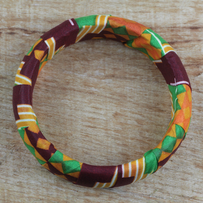 Wood and cotton bangle bracelet, 'Cheerful Sunrise' - Wrapped Cotton Print Bangle Bracelet in Green and Orange