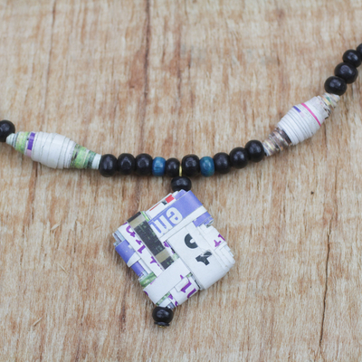 Recycled paper and wood beaded pendant necklace, 'Dreams of Home' - Recycled Paper and Wood Beaded Pendant Necklace from Ghana